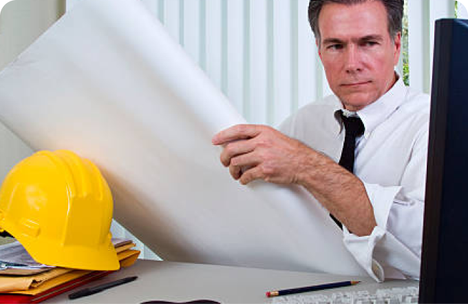 A man wearing a white shirt and tie is holding a piece of paper, with a thoughtful expression on his face.