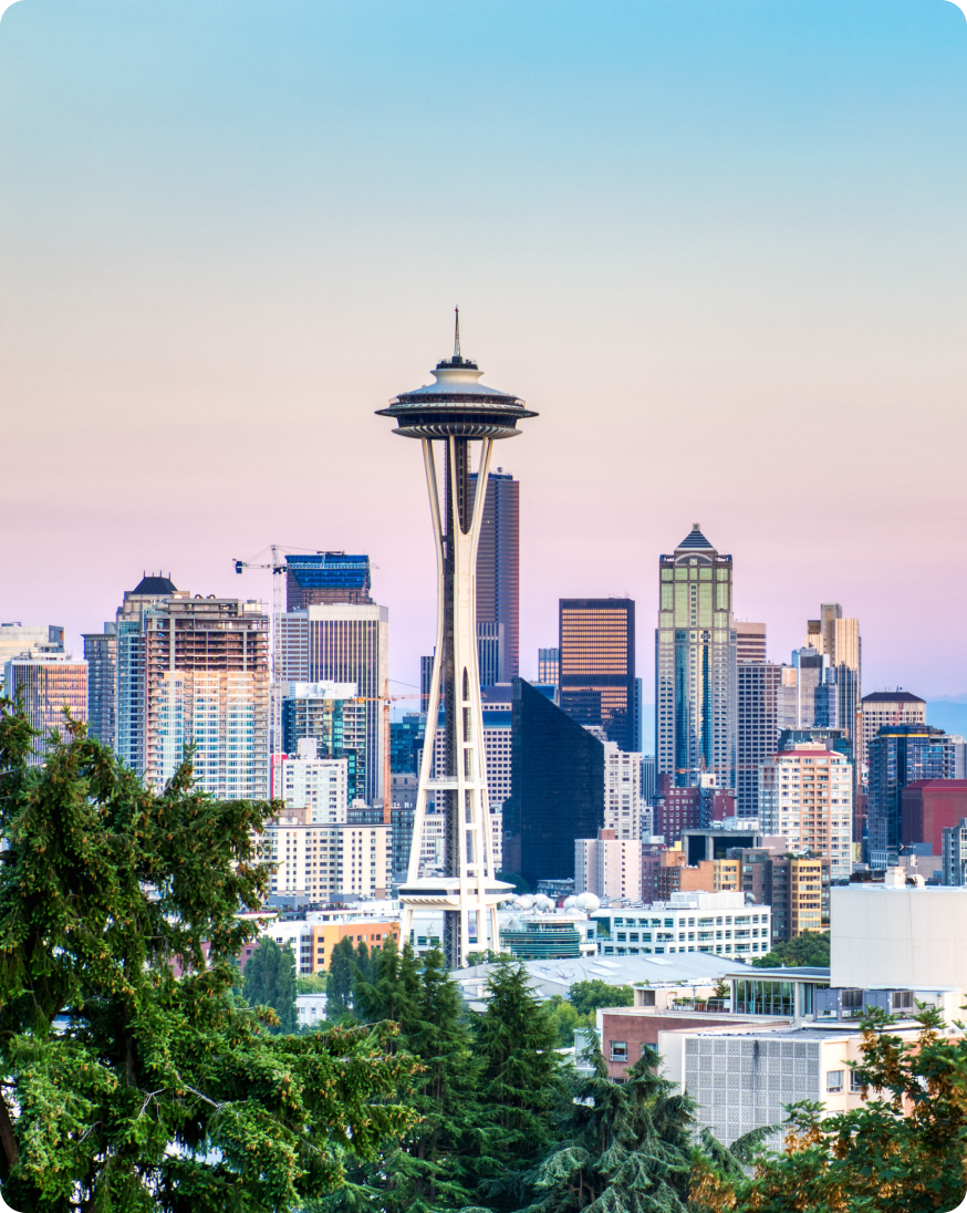 A view of the Seattle skyline with the Space Needle prominently displayed in the foreground, highlighting the city's landmarks.